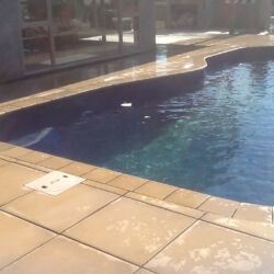 Paved area around pool with border